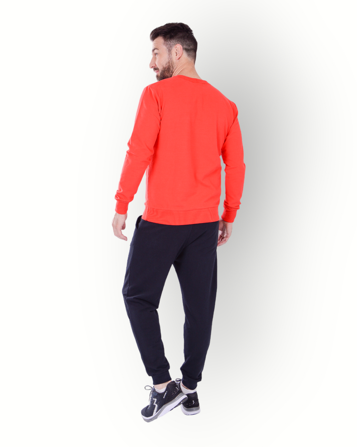 A man wearing a long sleeve red crew top in super soft stretch fabric.