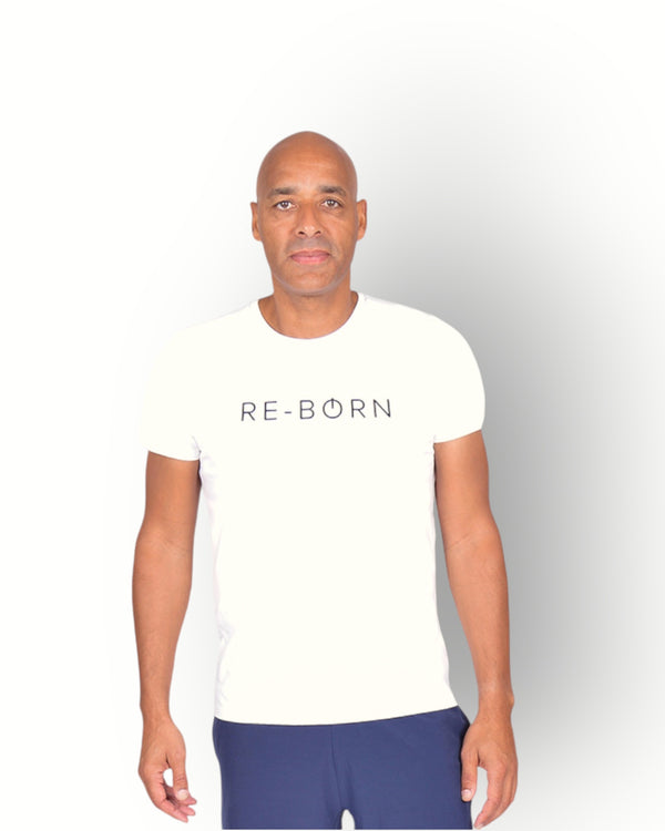 A man wearing a white short sleeve t-shirt with the text 'RE-BORN' on the front.