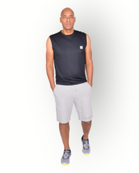 A man wearing a black sleeveless mesh light weight quick dry sport top with the text 'RE-BORN SPORTS' printed on the back, paired with gray shorts.