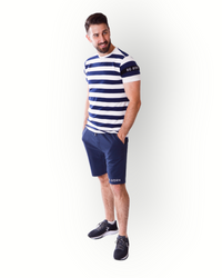 A man wearing a navy and white striped short-sleeve t-shirt with a crew neck and a small logo on the left sleeve.