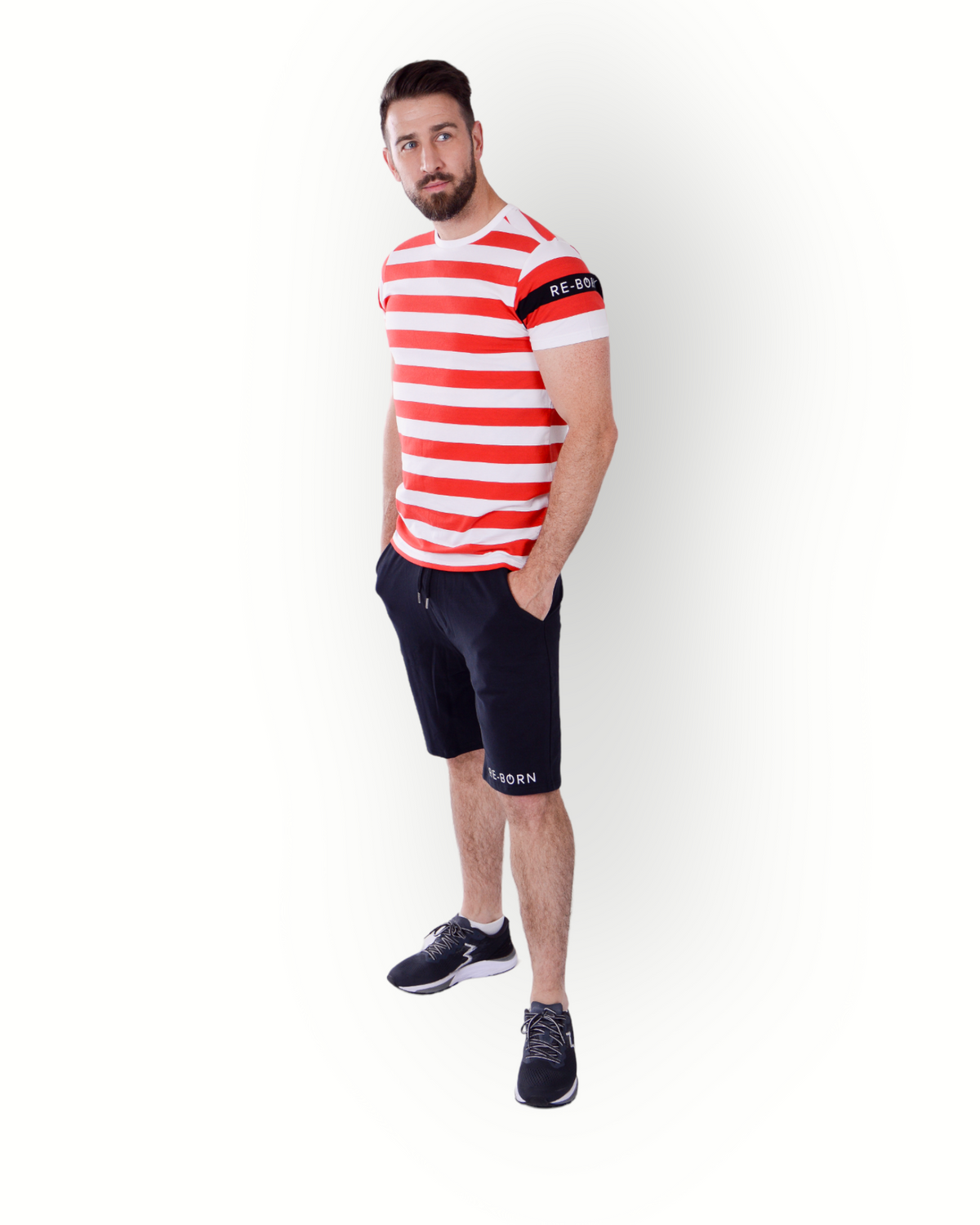 A man wearing a red and white striped short-sleeve t-shirt with a crew neck and a small logo on the left sleeve.