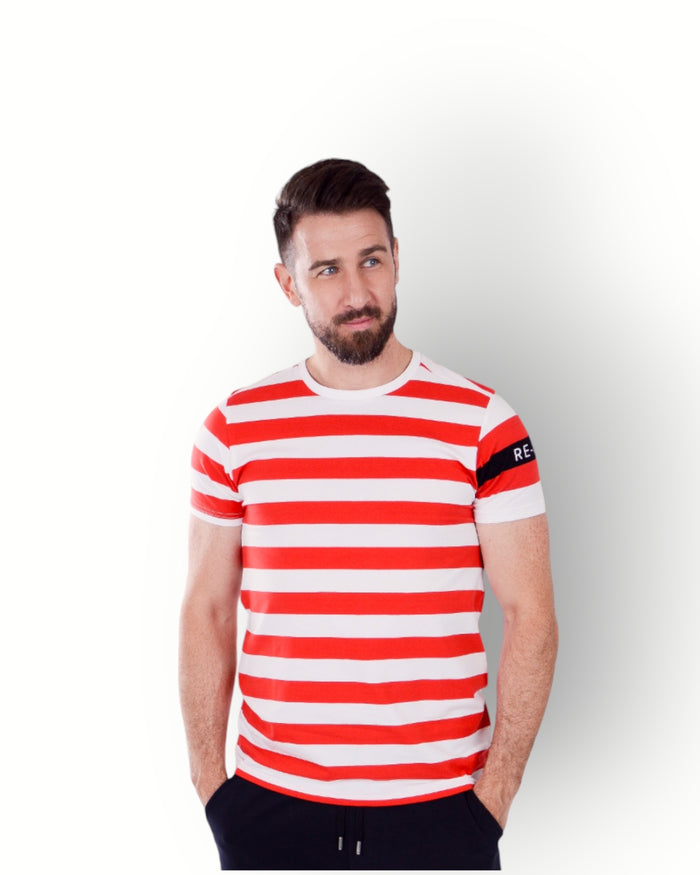 A man wearing a red and white striped short-sleeve t-shirt with a crew neck and a small logo on the left sleeve.