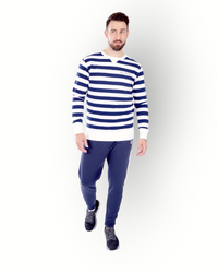A man wearing a long sleeve navy and white striped crew top with the brand name 'RE-BORN' on the chest.