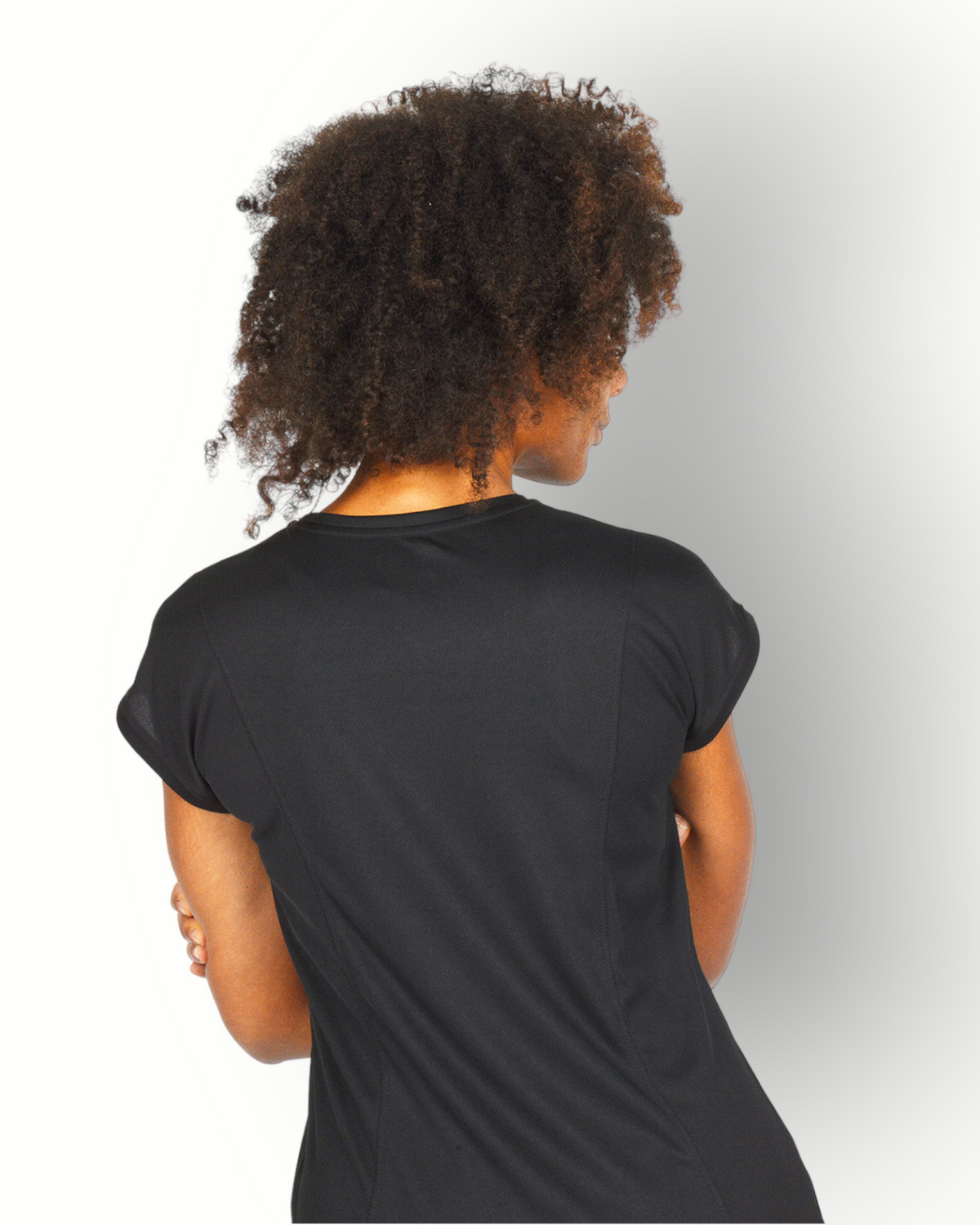 A woman wearing a black short sleeve mesh quick dry super light weight sport top with the text 'RE-BORN' on the chest.