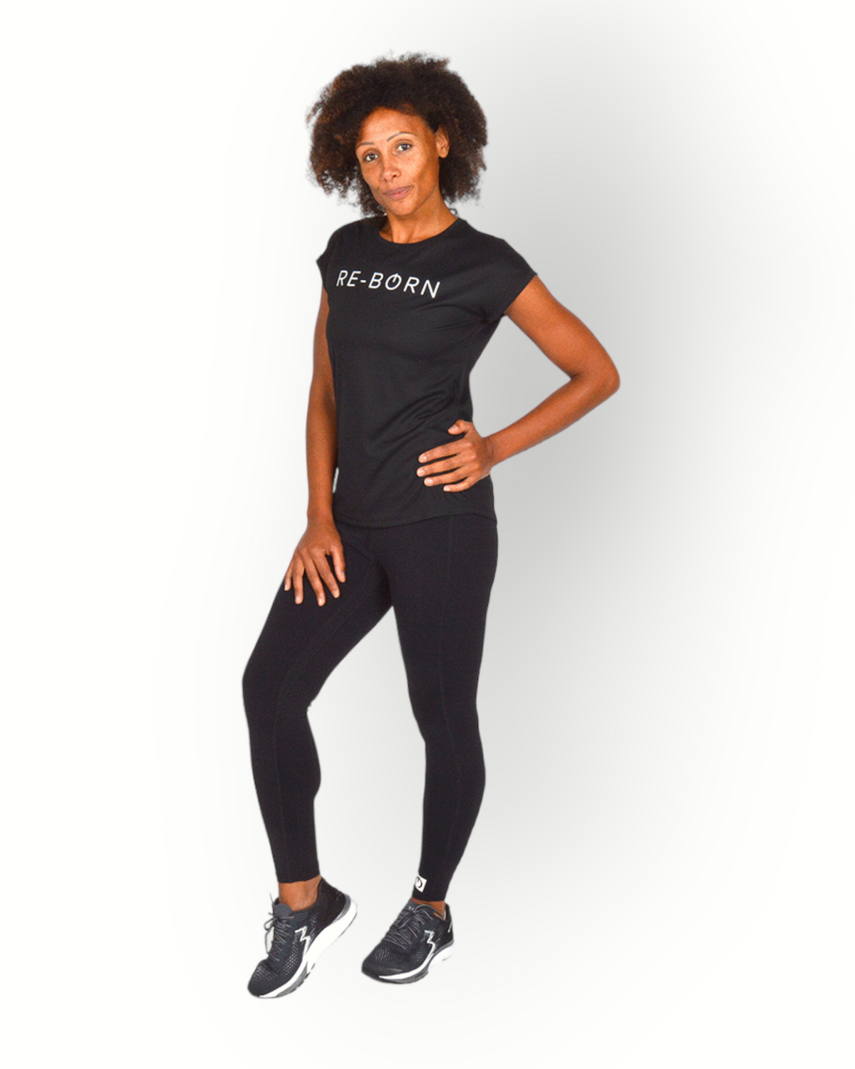 A woman wearing a black short sleeve mesh quick dry super light weight sport top with the text 'RE-BORN' on the chest.
