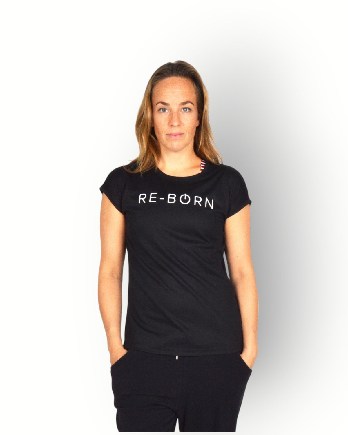 A woman wearing a black short sleeve mesh quick dry super light weight sport top with the text 'RE-BORN' on the chest.
