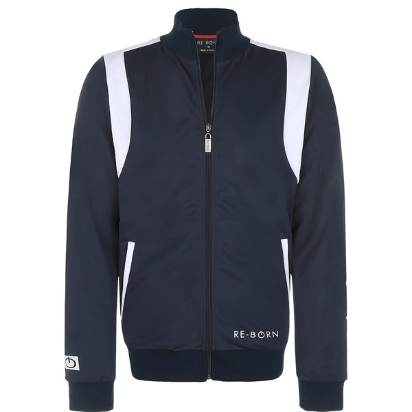 A navy and white color block tracktop with a full zipper, high collar, and side pockets.